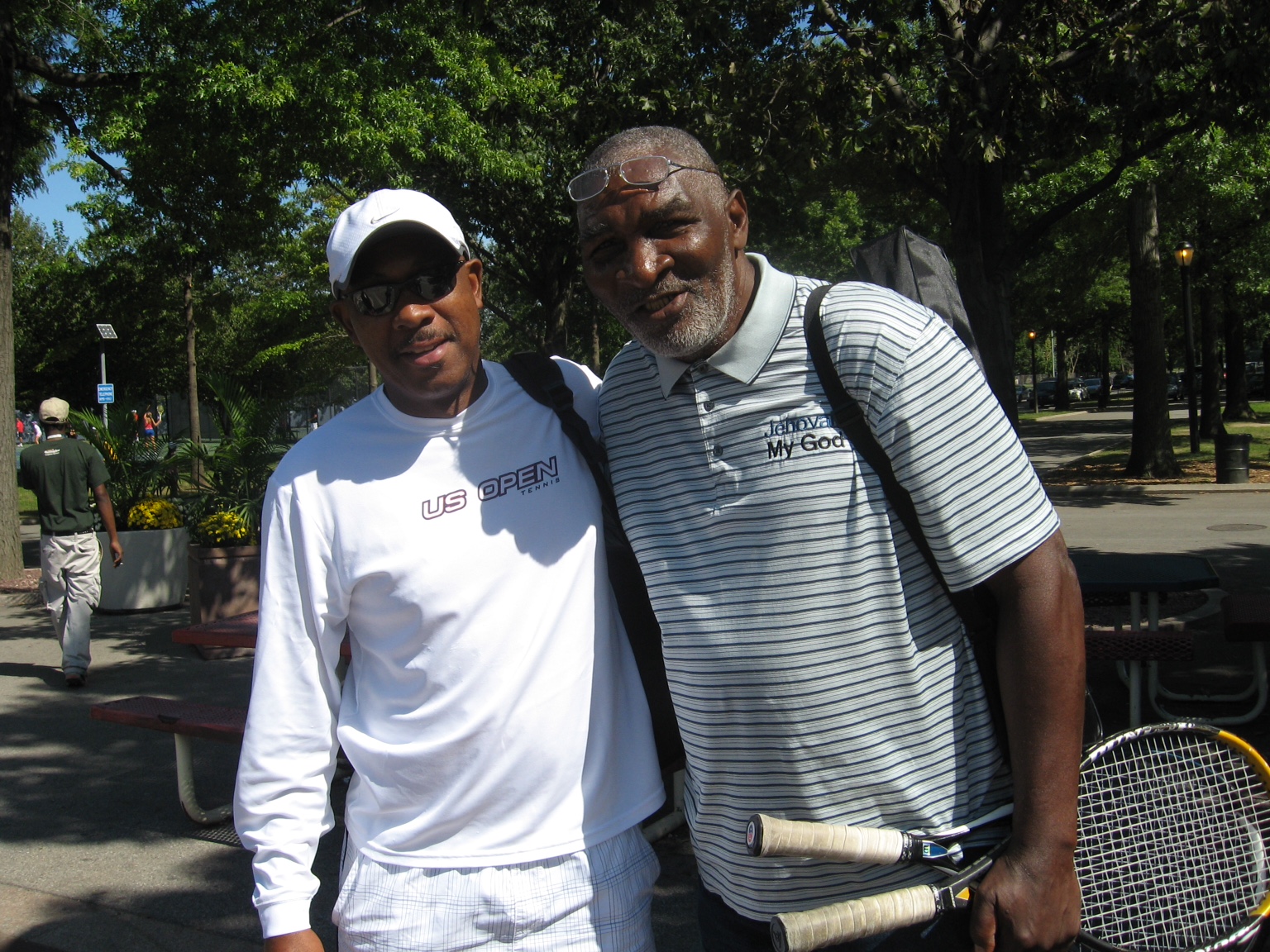 Andre in his US Open shirt with a friend on the tennis courts